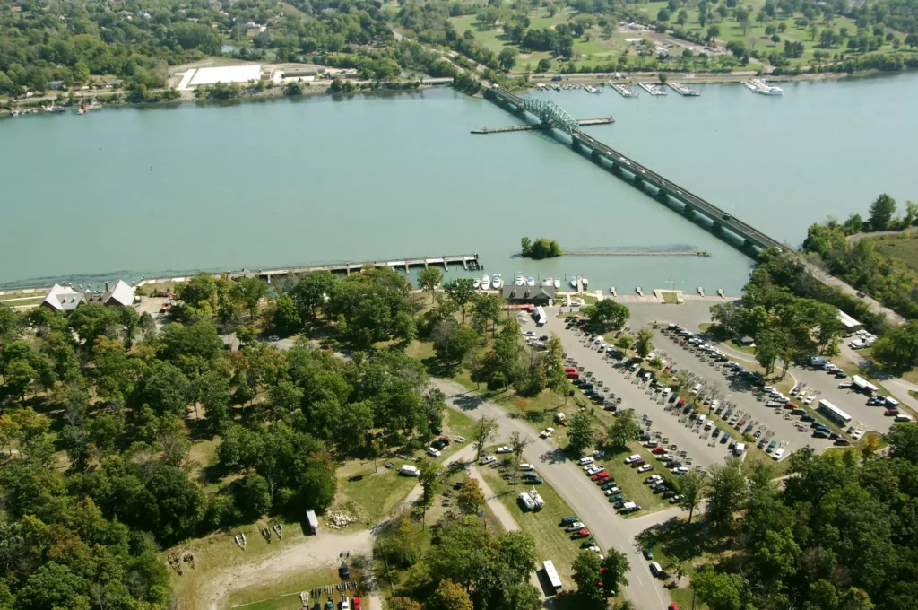 Aerial view of Elizabeth Park and the Grosse Ile Free Bridge over the Detroit River in Trenton, Michigan — historic Downriver community served by Help-U-Sell Real Estate of Metro Detroit